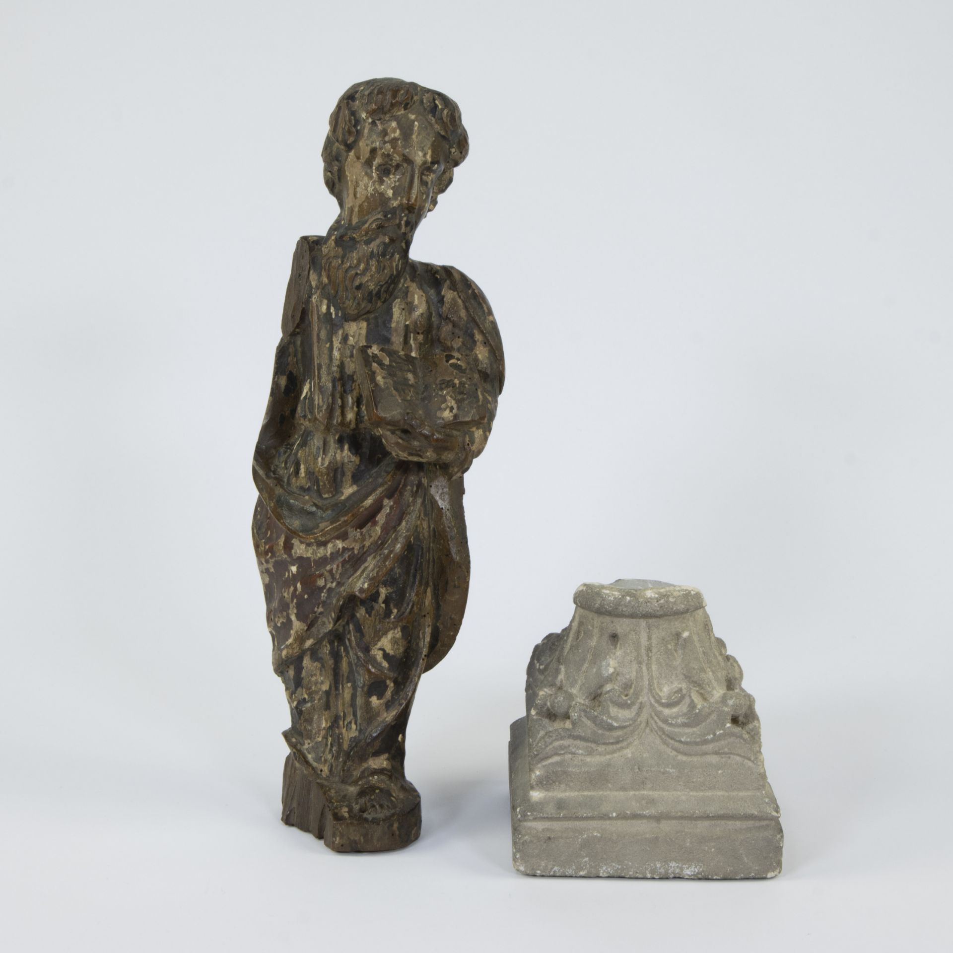 Wooden statue of an evangelist with polychromy, 19th century and capital of a column