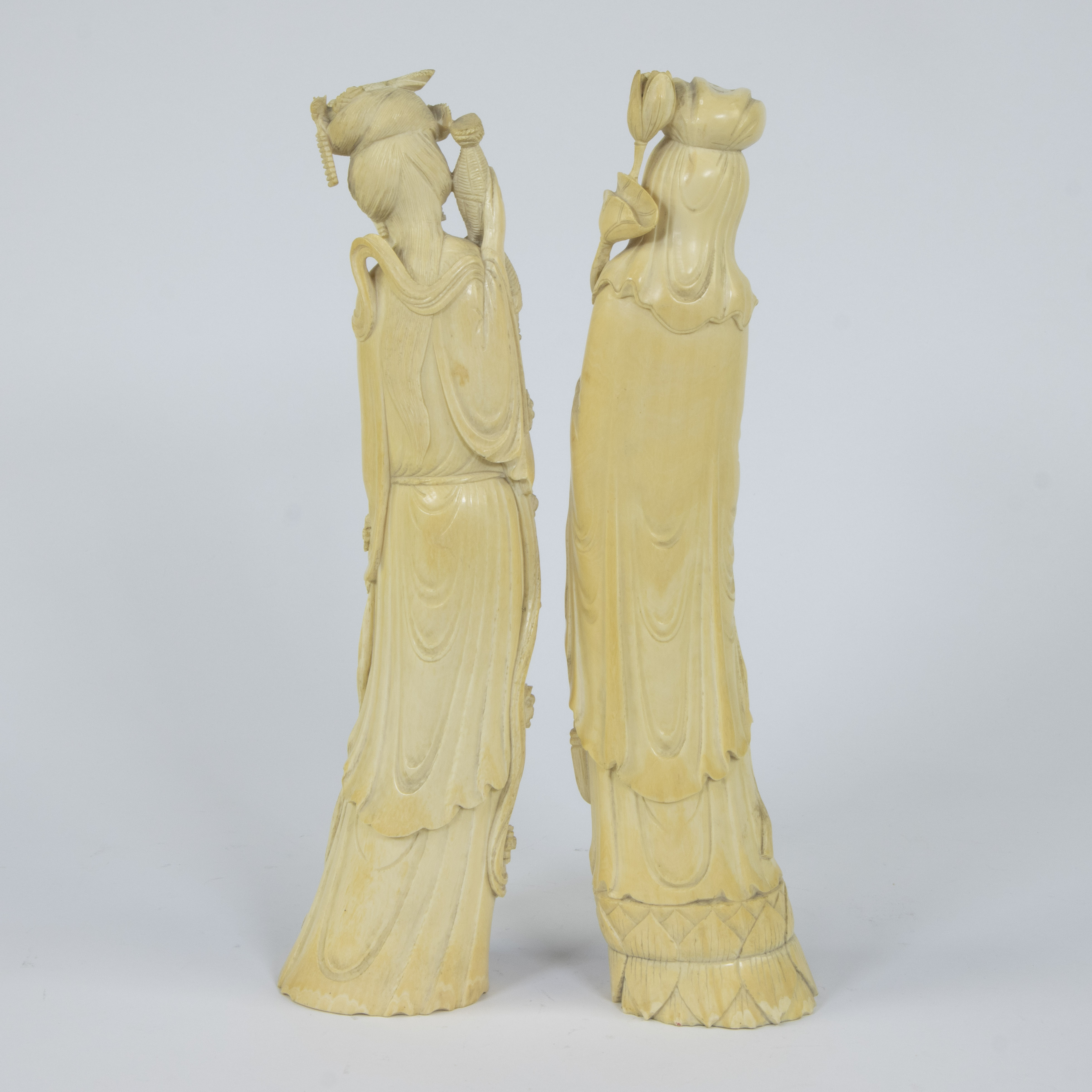 A pair of Japanese ivory sculptures depicting two female goddesses with long robes in a graceful bow - Image 3 of 5