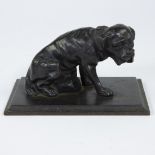 Cast iron paperweight in the shape of a sitting bulldog