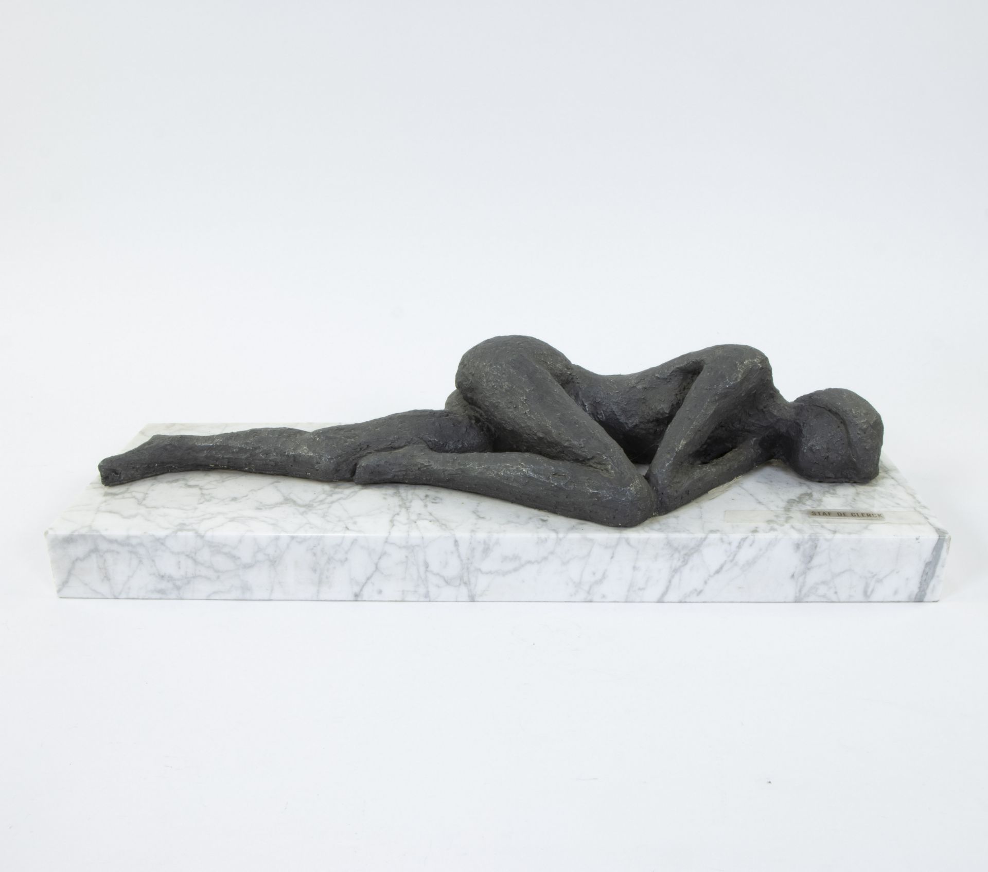 Staf De Clerck, sculpture of a reclining nude on marble plinth, signed