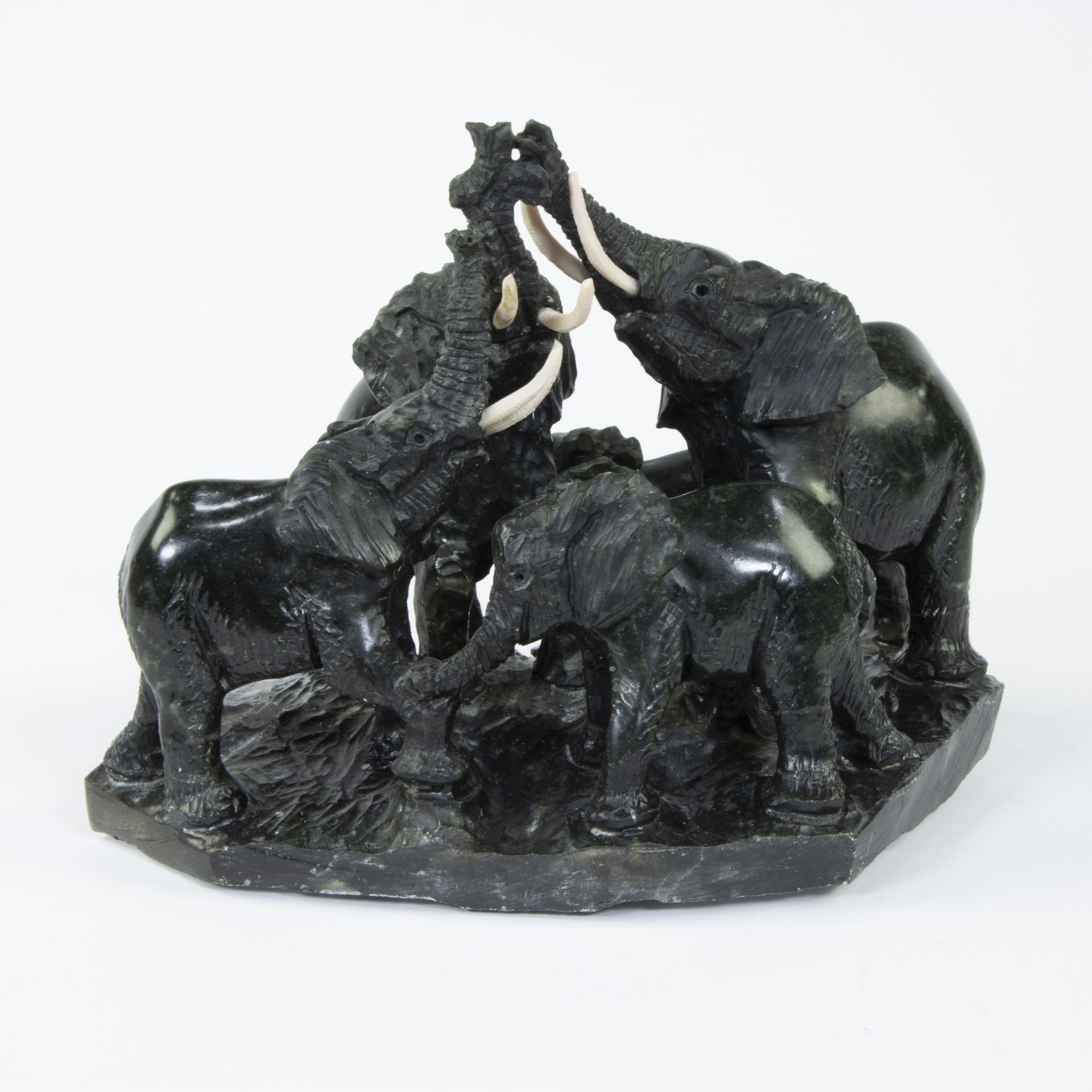 Beautiful hand sculpted sculpture of three elephants is of serpentine stone attributed to Joshua CHI