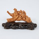 A Chinese group in red coral with figures and musicians, 19/20th century