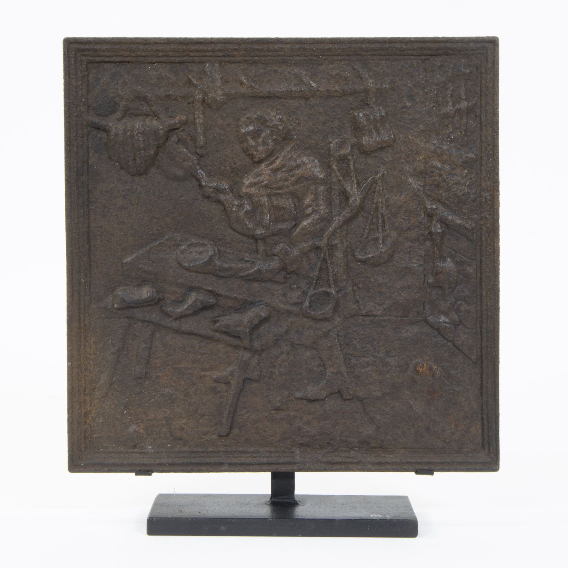 18th century cast-iron plaque with plinth depicting the butcher in his shop