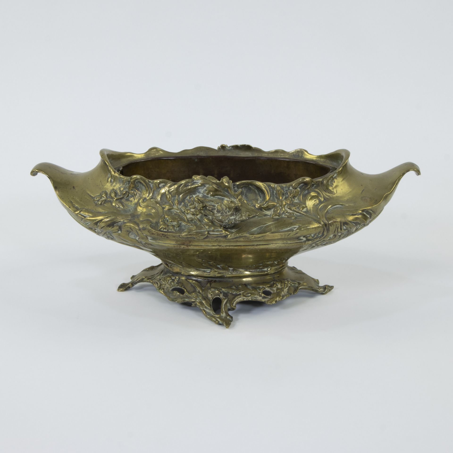 Jardinière in gilt brass decorated with floral motifs and a bird, circa 1920