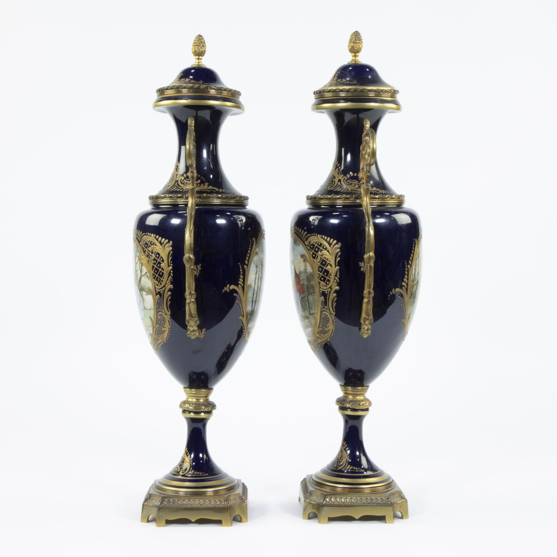 A pair of Sèvres ornamental vases of cobalt blue porcelain and gilt brass and decorated with multi-c - Image 3 of 7