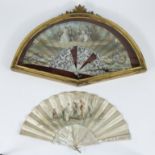 Set of 2 fans with hand-painted romantic decor, one signed and in a gilt Louis XV frame behind glass
