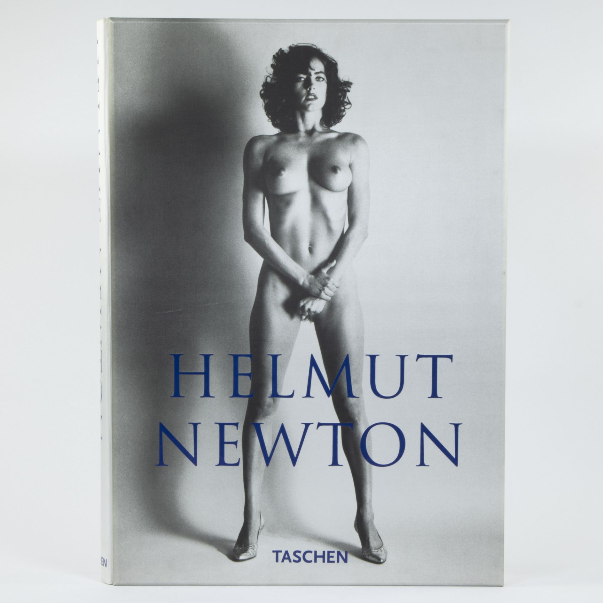 Large pancarte for book by Helmut Newton, publisher Tashen with various black and white photographs