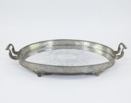 Large silver serving dish with central hand-engraved motif and finely perforated rim in the shape of