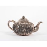 A SILVER TEAPOT