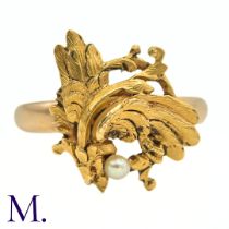 A Chimera Ring in 18k yellow gold, designed as a Chimera, set with a round pearl. French control
