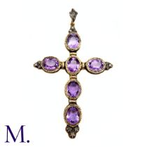 An Antique Amethyst And Diamond Cross Pendant in yellow gold and silver, the pendant set with six