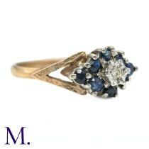 A Sapphire and Diamond Cluster Ring in 9k yellow gold the central illusion set diamond surrounded by