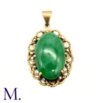 A Jade Pendant in yellow gold, the central oval jade cabochon set within a scalloped edge gold