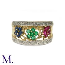 A Ruby, Emerald, Sapphire and Diamond Ring in 9k yellow gold, the open work band centred on three