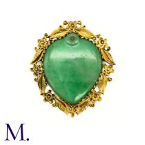 A Heart Shaped Jade Brooch in yellow gold, the central heart shaped jade plaque set within a foliate