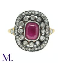 An Antique Ruby and Diamond Ring in 18ct yellow gold and silver, the central mixed cushion cut