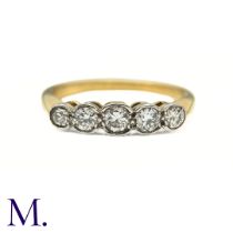 A Diamond Five Stone Ring in 18k yellow gold, collet set with five graduated round brilliant cut