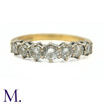 A Vintage Diamond 7-Stone Ring in yellow and white gold, claw set with seven graduated round