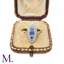 A Sapphire and Diamond Navette Ring in yellow and white gold, designed as a trio of round cut