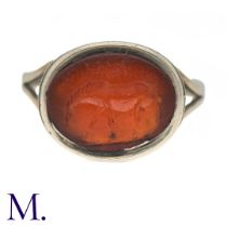 An Antique Intaglio Ring in yellow gold, the central reverse carved carnelian intaglio depicting a