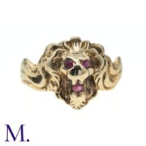 A Ruby Lion Ring in 10K yellow gold designed as a lion, the eyes and mouth set with round cut