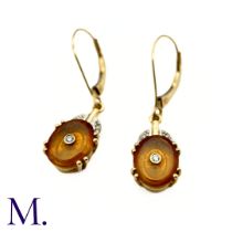 A Pair of Diamond and Garnet Earrings in 9k yellow gold, each oval spessartite garnet drop earring