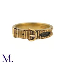 An Antique Hairwork Mourning ring in 15k yellow gold, of belt buckle design the fluted band with