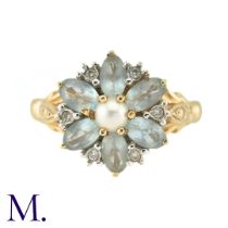 A Pearl, White Sapphire And Aquamarine Dress Ring, in 14k yellow gold, the central pearl