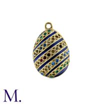 An Enamelled Egg Pendant with blue enamel, set with blue, red and green paste stones. No markings