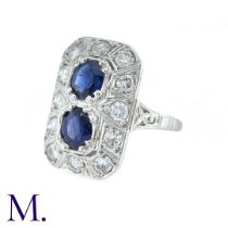An Art Deco Sapphire And Diamond Ring in 18k white gold, set with two principal cushion cut