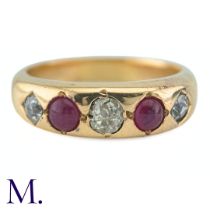 A Ruby And Diamond Gypsy Ring in yellow gold, set with three old cut diamonds punctuated by two