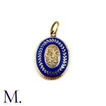 An Antique Mourning Locket Pendant in yellow gold, the oval form with engraved scrolling detail to