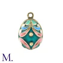 An Enamelled Egg Pendant, with green, pink, blue and white enamel. No marks visible. Size: 2.1cm