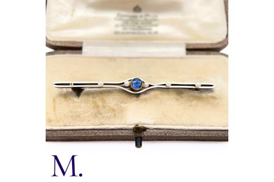 A Sapphire and Pearl Bar Brooch in yellow and platinum, set with a round cut sapphire to the centre, - Image 6 of 6