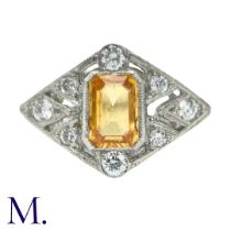 A Yellow Sapphire And Diamond Ring