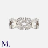 CARTIER. A Diamond Heart Ring in 18K white gold, with alternating hearts, one set with round cut