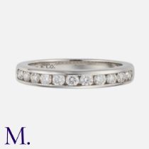TIFFANY & CO. A Diamond Half Eternity Ring in Platinum, set with eleven brilliant cut diamonds