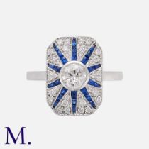 An Art Deco Style Sapphire & Diamond Ring in 18k white gold, set with a principally cut diamond of