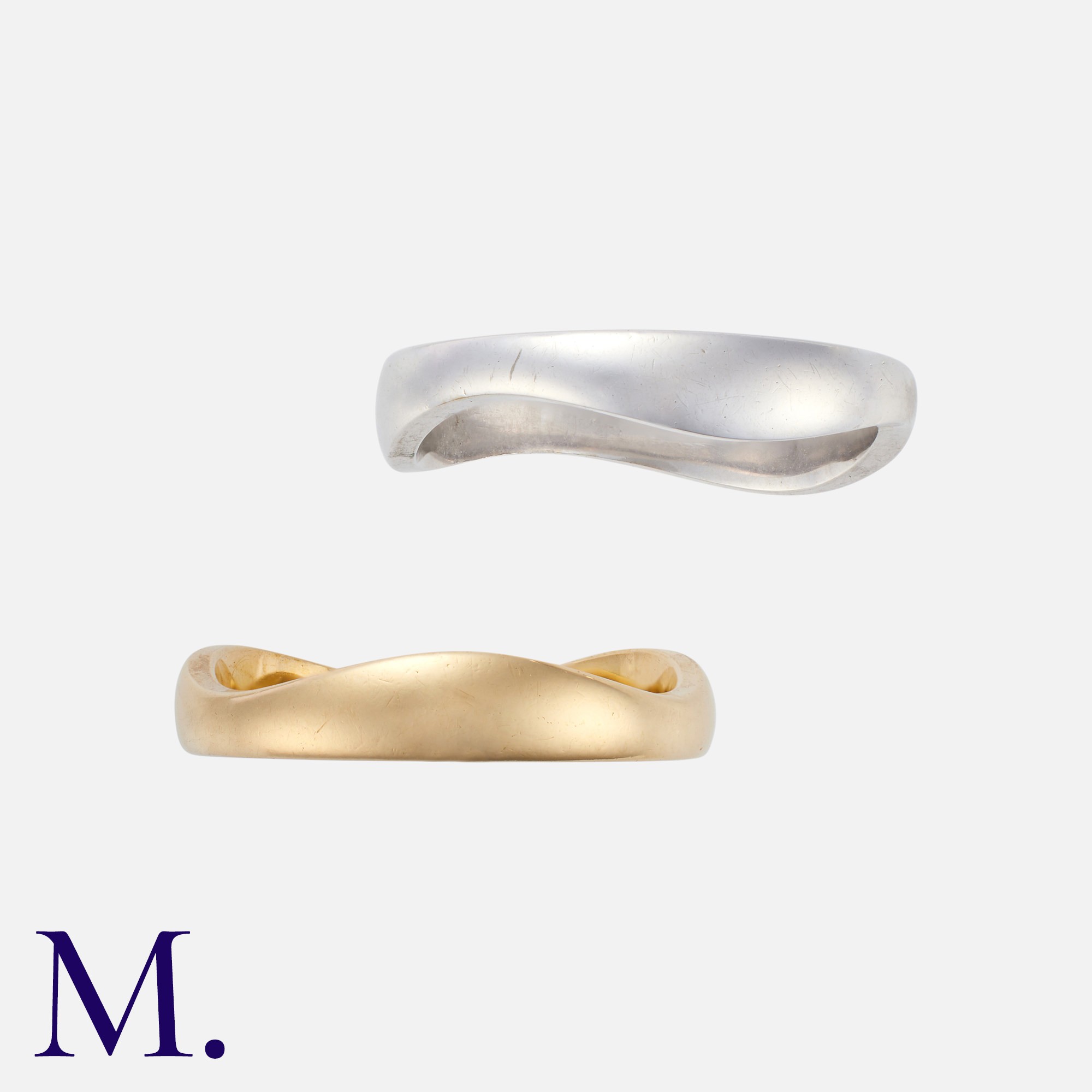 CARTIER. A Pair of Gold Wave Bands in 18K white and yellow gold, of separate interlocking bands. - Image 2 of 3