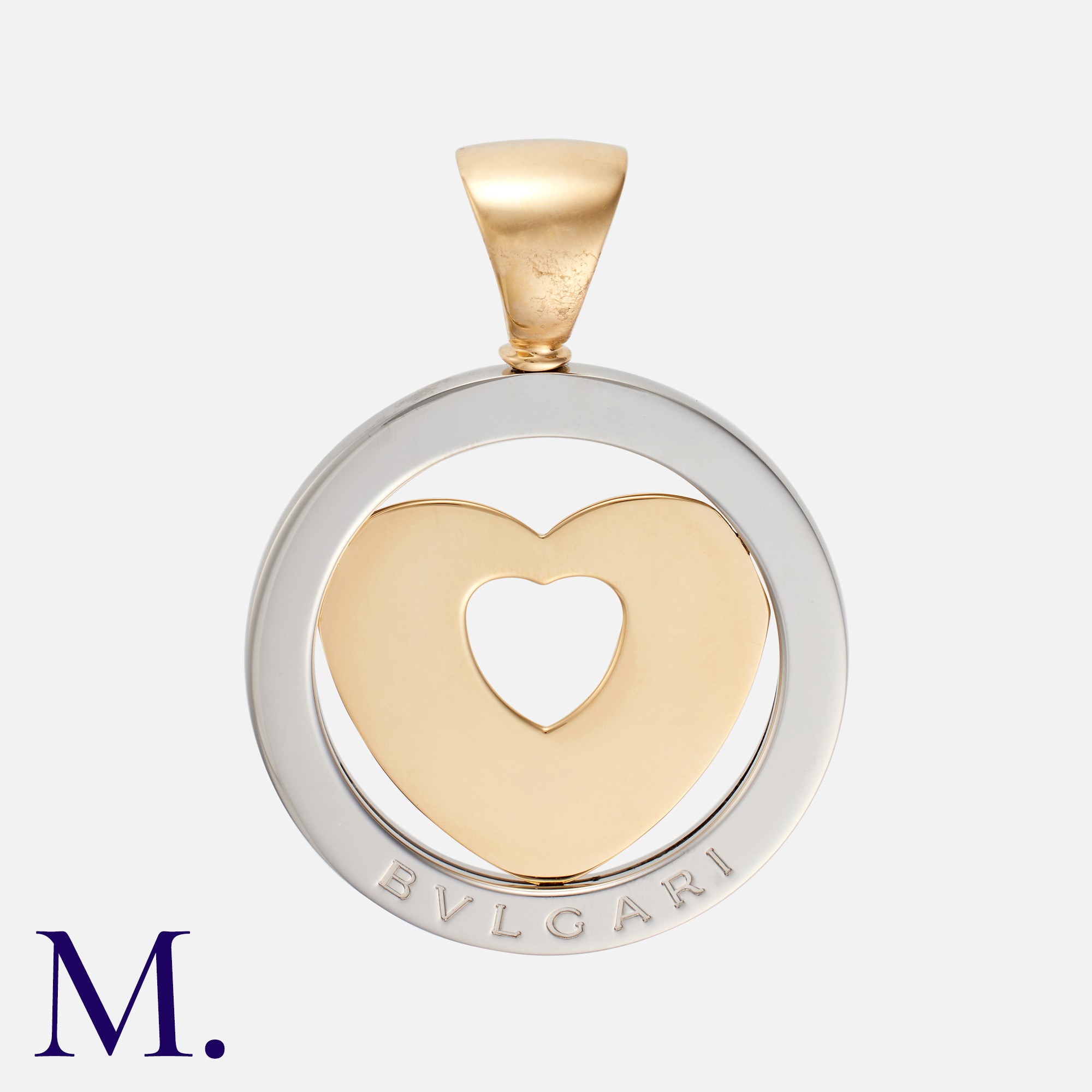 BULGARI. A Tondo Heart Pendant in 18k yellow gold and stainless steel, the stainless steel circle
