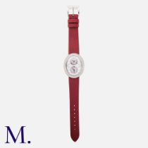 Speake-Marin. A ladies 18ct white gold and diamond dress watch, the oval white dial with dual time