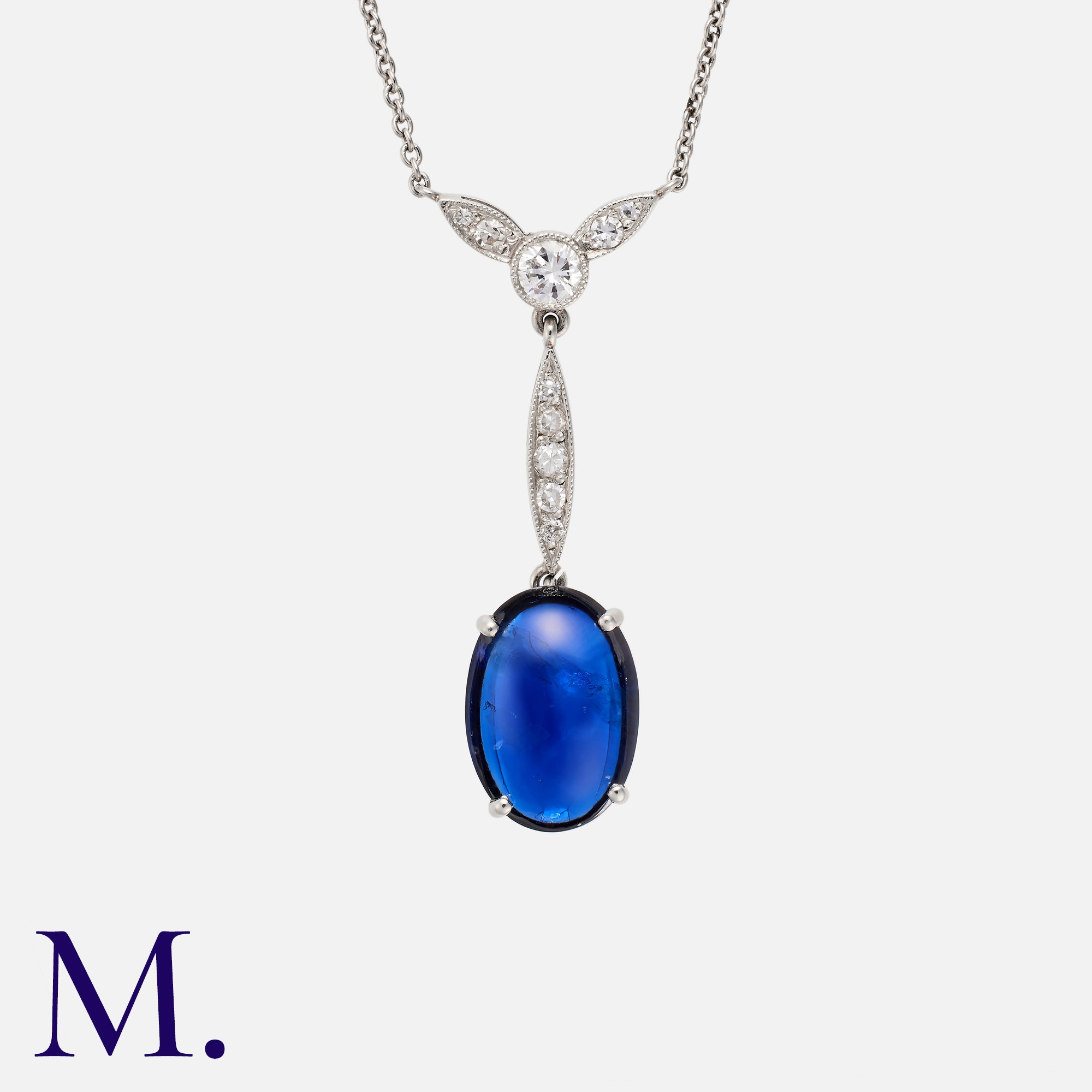 A Cabochon Sapphire And Diamond Pendant Necklace, in platinum comprising a cabochon blue sapphire of