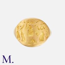 ZOLOTAS. A Signet Ring in 18K yellow gold with carved female forms to the oval face. Size: K Weight: