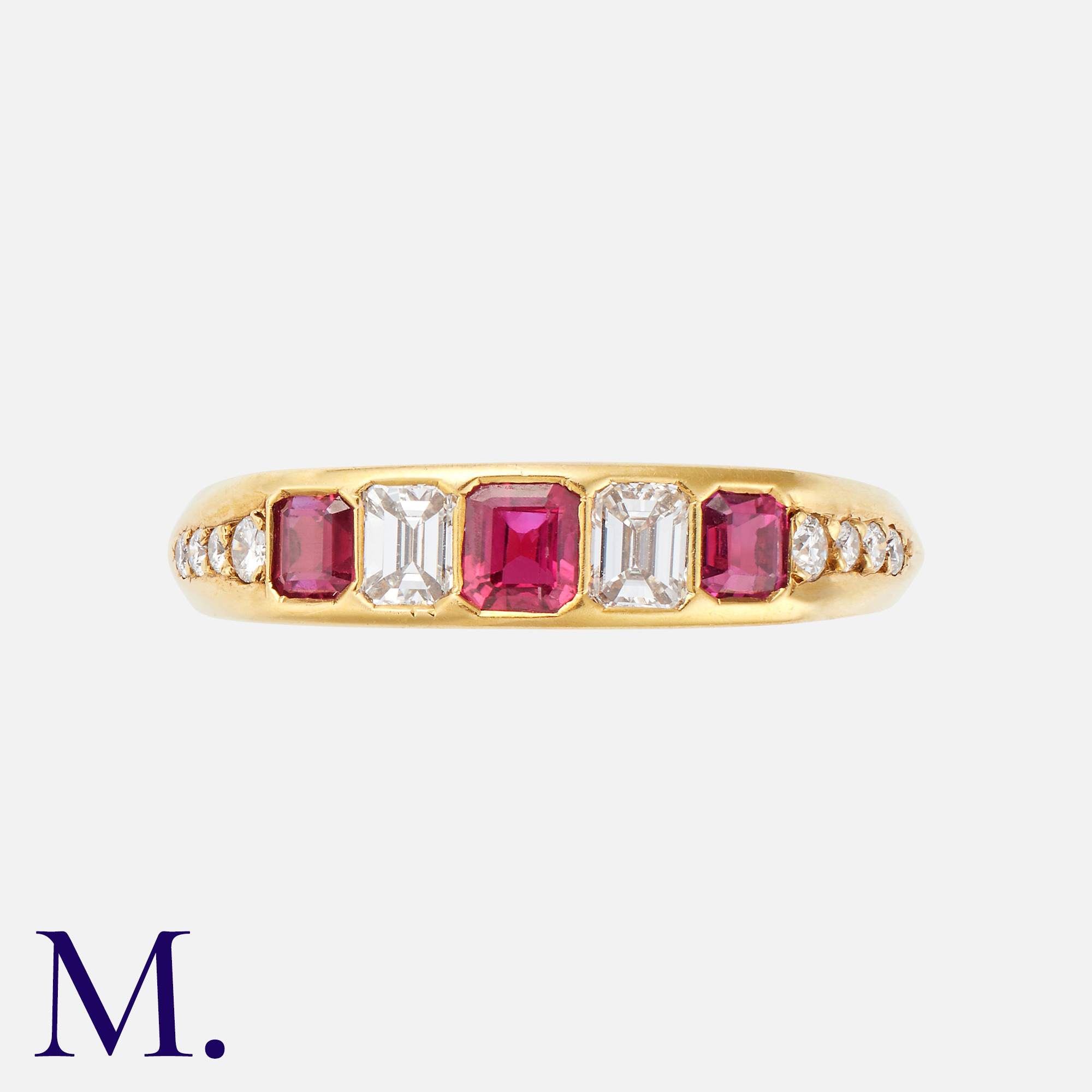 A Ruby & Diamond Ring in 18K yellow gold, set with three emerald cut rubies and two emerald cut