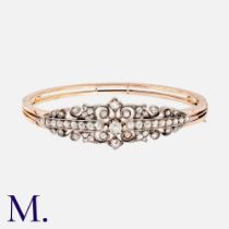 An Antique Diamond Bangle in yellow gold and silver, set with a principal old cut diamond of