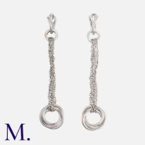 CARTIER. A Pair of Trinity Earrings in 18K white gold, with trinity rings set to entwined chains,