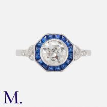 A Sapphire & Diamond Target Ring in 18k white gold, set with a principal old cut diamond of
