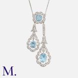An Aquamarine & Diamond Pendant Negligee Necklace in platinum, the pendant set with round cut and