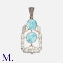 A Zircon & Diamond Pendant, the Art Deco form set with two large zircons, each of approximately 9mm,