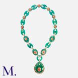 A Chrysoprase, Coral & Diamond Pendant Necklace in 14k yellow gold, comprising a series of carved